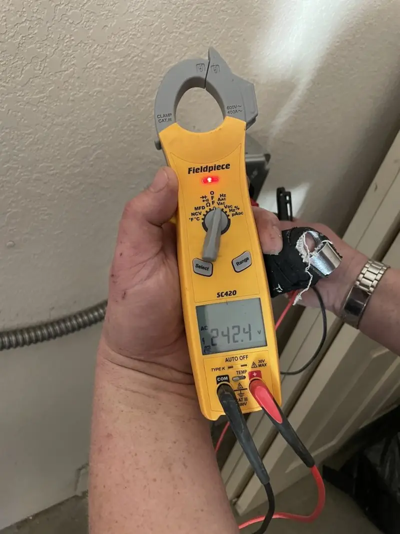 Voltage testing with clamp meter during Generator Installation in Emmaus